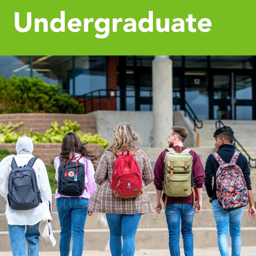 A group of five students approaching the university centre.